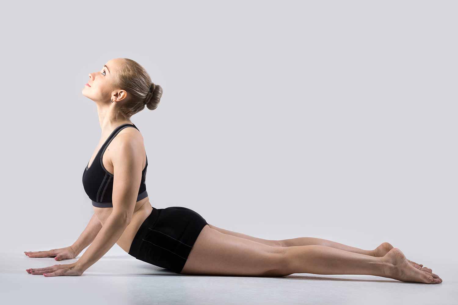 girl doing full cobra pose (yoga)